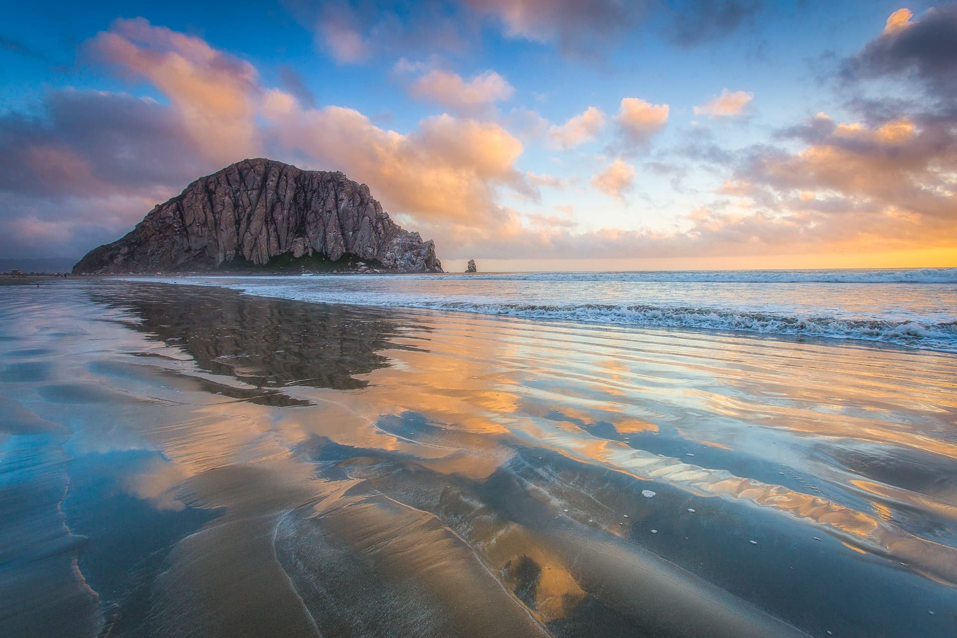 Morro Rock reflected on wet sand at sunset, Morro Bay